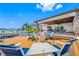 Outdoor seating around a firepit on a wooden patio overlooking the water at 4803 Longwater Way, Tampa, FL 33615