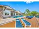 Backyard with a private pool, lounge chairs, and waterfront views at 4803 Longwater Way, Tampa, FL 33615