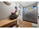 Storage room includes a stainless steel refrigerator and brick flooring at 4803 Longwater Way, Tampa, FL 33615