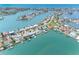 Aerial view of waterfront neighborhood with stunning water views and well-maintained homes at 512 173Rd E Ave, North Redington Beach, FL 33708