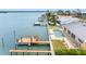 A waterfront property featuring a private pool, dock, and an outdoor patio, perfect for relaxation at 512 173Rd E Ave, North Redington Beach, FL 33708