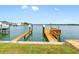 A wooden dock provides direct access to the water, perfect for boating and enjoying waterfront activities at 512 173Rd E Ave, North Redington Beach, FL 33708
