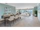Spacious living room with tile floors, modern furnishings, and water views at 512 173Rd E Ave, North Redington Beach, FL 33708