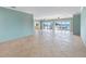 Spacious living room with waterfront views and tile flooring at 512 173Rd E Ave, North Redington Beach, FL 33708