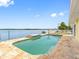 The pool area provides an outdoor retreat with a view of the waterfront at 512 173Rd E Ave, North Redington Beach, FL 33708