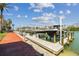 Picturesque dock with boats, set against a backdrop of clear skies and calm waters at 525 Mandalay Ave # 33, Clearwater Beach, FL 33767