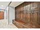 Hallway with custom built-in wood cabinets and bench seating, offering ample storage at 525 Mandalay Ave # 33, Clearwater Beach, FL 33767