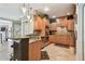 Kitchen area with granite countertops, stainless appliances, and adjacent breakfast bar in an open-concept layout at 525 Mandalay Ave # 33, Clearwater Beach, FL 33767