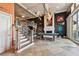 Grand living room features a pool table, fireplace, and elegant staircase at 525 Mandalay Ave # 33, Clearwater Beach, FL 33767