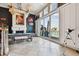 Luxurious living room with pool table, fireplace, and large windows overlooking the water at 525 Mandalay Ave # 33, Clearwater Beach, FL 33767
