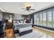 Luxurious main bedroom with a plush bed, hardwood floors, and a view of the landscape at 525 Mandalay Ave # 33, Clearwater Beach, FL 33767