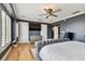 Nicely appointed main bedroom with a TV, dresser, and elegant furnishings at 525 Mandalay Ave # 33, Clearwater Beach, FL 33767