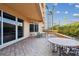 Relax on this outdoor patio with stone pavers, lush landscaping, and comfortable seating at 525 Mandalay Ave # 33, Clearwater Beach, FL 33767