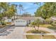 Aerial view of a landscaped home with a driveway and a well maintained yard at 5317 Black Pine Dr, Tampa, FL 33624