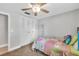 Bright bedroom featuring a comfortable bed, a ceiling fan, and closet at 5317 Black Pine Dr, Tampa, FL 33624