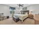 Cozy bedroom with carpet flooring, neutral paint, and large window at 5317 Black Pine Dr, Tampa, FL 33624