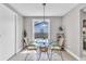 Cozy dining area with a glass table and ample natural light at 5317 Black Pine Dr, Tampa, FL 33624