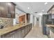 Spacious kitchen with granite countertops, modern appliances, and tile backsplash at 5317 Black Pine Dr, Tampa, FL 33624