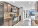 Contemporary kitchen featuring dark wood cabinets and stainless steel appliances at 5317 Black Pine Dr, Tampa, FL 33624