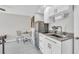 Cozy kitchen with stainless steel refrigerator, modern countertops, and eating space at 5317 Black Pine Dr, Tampa, FL 33624