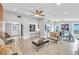 Open concept living room featuring tile floors, neutral walls, and combined dining and kitchen area at 5317 Black Pine Dr, Tampa, FL 33624