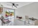 Open floor plan living room with a sliding glass door to the outdoor living space at 5317 Black Pine Dr, Tampa, FL 33624