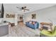 Comfortable living room featuring modern decor and open access to dining and kitchen areas at 5317 Black Pine Dr, Tampa, FL 33624