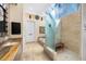 Bathroom featuring a glass-enclosed shower and a soaking tub by a large window at 5812 Mariners Watch Dr, Tampa, FL 33615