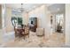 Bright dining room with decorative lighting, classic china cabinet, and lots of natural light at 5812 Mariners Watch Dr, Tampa, FL 33615