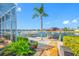 Waterfront dock featuring a boat lift, jet ski lift, and a charming gazebo at 5812 Mariners Watch Dr, Tampa, FL 33615