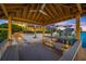 Covered boat dock with seating overlooking the waterway and providing a relaxing outdoor space at 5812 Mariners Watch Dr, Tampa, FL 33615