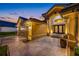 Attractive home exterior with a well-manicured lawn and a grand entrance with beautiful double doors at 5812 Mariners Watch Dr, Tampa, FL 33615