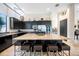 Bright and modern kitchen with sleek cabinetry, a large island, and stainless steel appliances at 5812 Mariners Watch Dr, Tampa, FL 33615