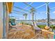 Covered lanai with seating and a view of the waterfront and pool at 5812 Mariners Watch Dr, Tampa, FL 33615