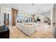 Open-concept living room showcases tile floors, comfortable seating and access to the outdoors at 5812 Mariners Watch Dr, Tampa, FL 33615