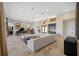 Expansive living room offers plenty of seating, a bar area, and views into the foyer at 5812 Mariners Watch Dr, Tampa, FL 33615