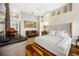 Spacious main bedroom features hardwood floors, a decorative rug, and ensuite bathroom access at 5812 Mariners Watch Dr, Tampa, FL 33615