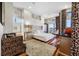 Luxurious main bedroom boasting hardwood floors, a decorative rug, and high ceilings at 5812 Mariners Watch Dr, Tampa, FL 33615