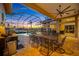 Spacious outdoor dining area with a large table, perfect for entertaining, and featuring views of the pool and waterfront at 5812 Mariners Watch Dr, Tampa, FL 33615