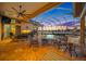 Inviting outdoor living area with comfortable seating, ideal for relaxing and enjoying the pool and tranquil waterfront views at 5812 Mariners Watch Dr, Tampa, FL 33615