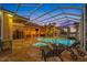 Beautiful screened pool and spa with an outdoor kitchen and plenty of room for entertaining at 5812 Mariners Watch Dr, Tampa, FL 33615