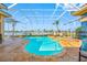 Screened-in pool with a unique shape and waterfront view at 5812 Mariners Watch Dr, Tampa, FL 33615