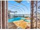 Screened-in patio with a private pool and jacuzzi overlooking a waterfront view at 5812 Mariners Watch Dr, Tampa, FL 33615