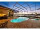 Inviting screened-in pool area with a built-in spa, perfect for relaxation and enjoying waterfront views at 5812 Mariners Watch Dr, Tampa, FL 33615