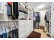 Custom walk-in closet with ample storage and well-organized shelving units at 5812 Mariners Watch Dr, Tampa, FL 33615