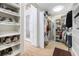 Spacious walk-in closet with custom shelving and organization system at 5812 Mariners Watch Dr, Tampa, FL 33615