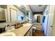 Well-lit bathroom featuring vanity with countertop space and a separate bathing area at 6051 106Th N Ave, Pinellas Park, FL 33782