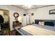 Bedroom with desk, carpet, bed with gray headboard, and access to closet and bathroom at 6051 106Th N Ave, Pinellas Park, FL 33782