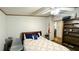 Bedroom with bed, chair, book shelf, and adjoining rooms at 6051 106Th N Ave, Pinellas Park, FL 33782