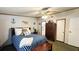 Comfortable bedroom with nautical decor, wooden furniture, and ample natural light at 6051 106Th N Ave, Pinellas Park, FL 33782
